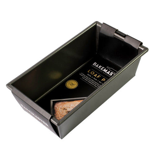 Non-stick box-sided loaf pan with a small loaf inside and label on side