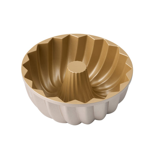 Two-tone fluted ring cake pan with champagne interior and white sides