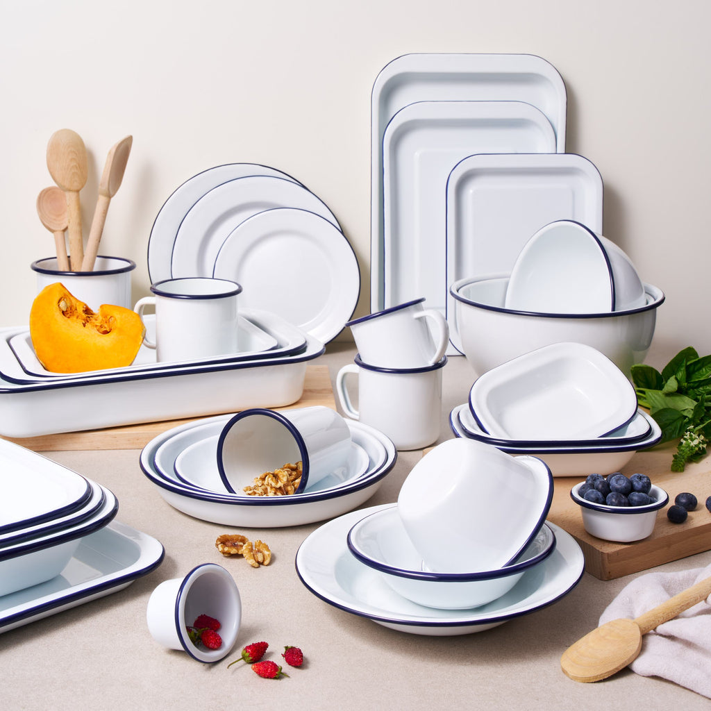 White enamel side plate set with blue rim, stacked for serving